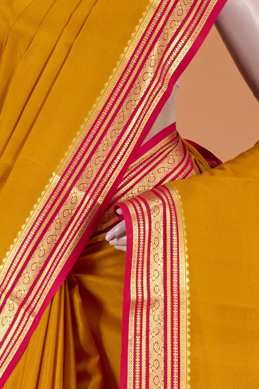 Vellotis Mustard Yellow Silk Saree with Pink Border & Zari Work – Festive & Traditional Wear